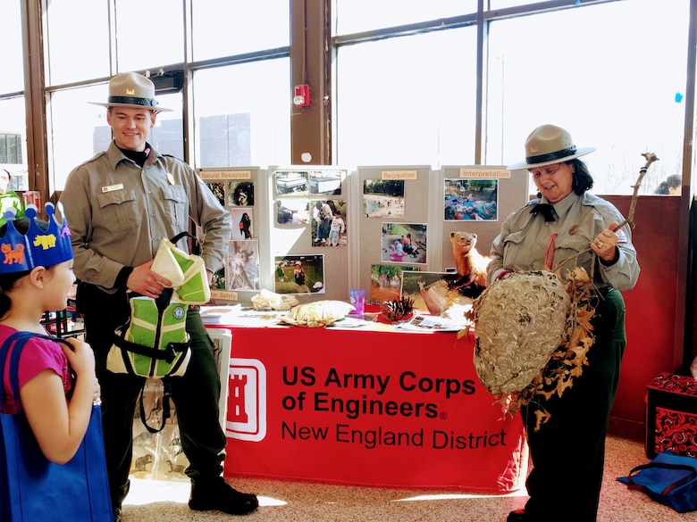 West Hill Dam Park Rangers Ron Woodall and Viola Bramel speak to a student during a local fair.  West Hill Dam Junior Rangers who visit Corps Educational Booths or attend interpretative programs at the dam receive credit towards graduation.