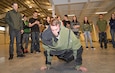 Soldier in EOD suit doing push ups