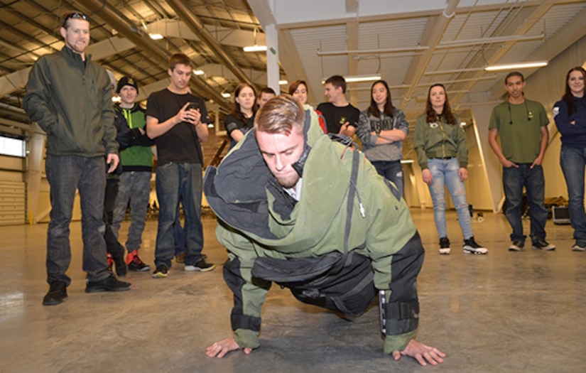 Soldier in EOD suit doing push ups