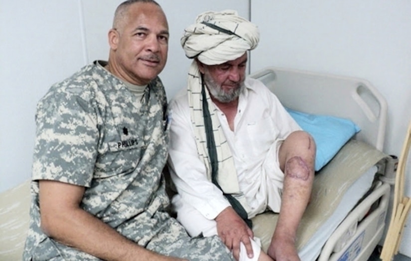 Army doctor with a foreign patient
