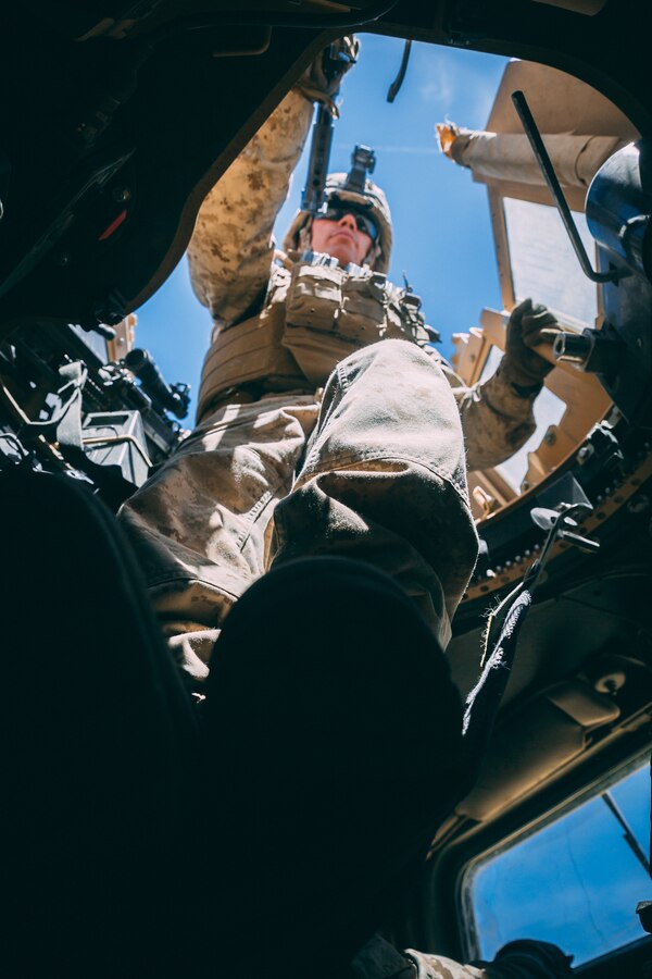 Marines with 7th Marine Regiment, 1st Marine Division, provide a Quick Reaction Force at the Air Combat Element landing strip during an airfield attack as a part of Integrated Training Exercise 3-18 aboard the Marine Corps Air Ground Combat Center, Twentynine Palms, Calif., May 5, 2018. The purpose of ITX is to create a challenging, realistic training environment that produces combat-ready forces capable of operating as an integrated MAGTF. (U.S. Marine Corps photo by Lance Cpl. William Chockey)