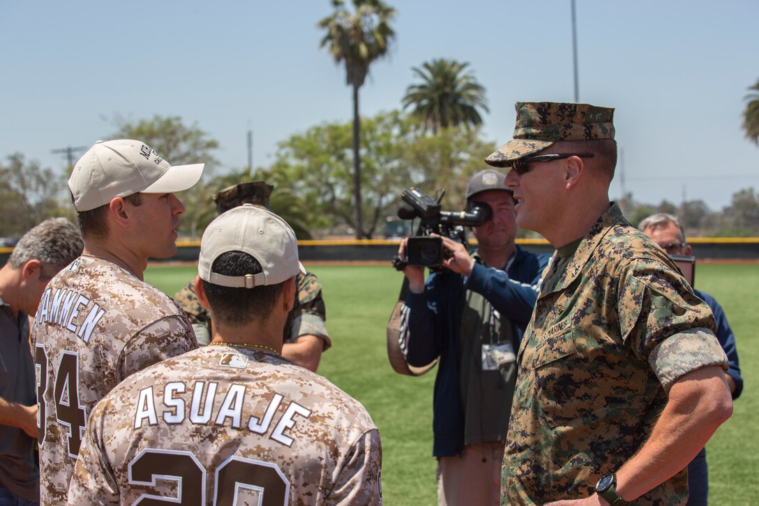 Maj. Gen. Mark R. Wise, commanding general of 3rd Marine Aircraft Wing, gives Marines with Marine Corps Air Station (MCAS) Miramar words of encouragement before a game between the San Diego Padres and MCAS Miramar softball team at MCAS Miramar, Calif., May 10. The Padres Alumni came to demonstrate their support for the military with spirited competition and to thank the service members of MCAS Miramar for their service. (U.S. Marine Corps photo by Cpl. Daniel Auvert/Released)