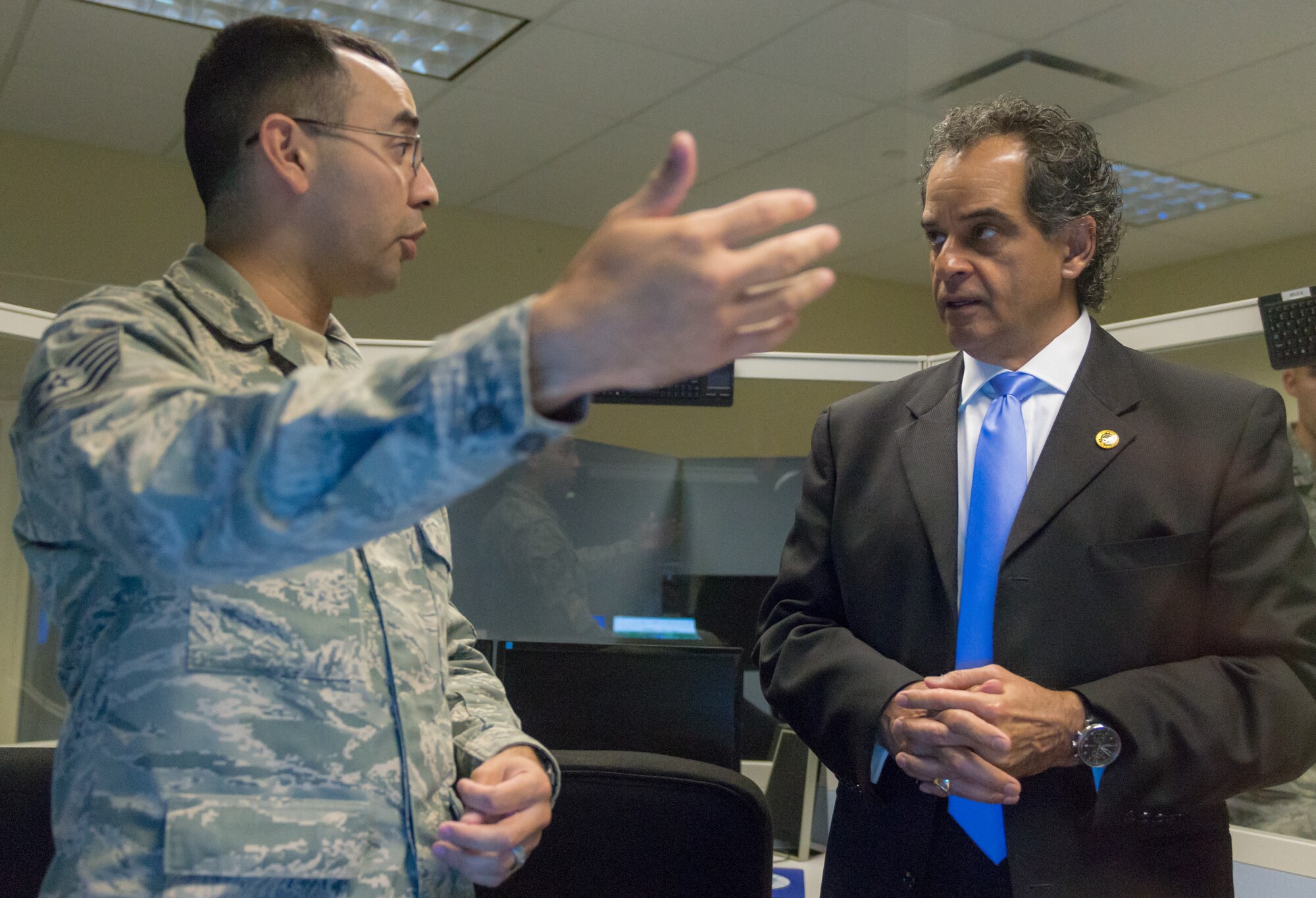 U.S. Air Force Tech. Sgt. Benito Carrasco, 334th Training Squadron Airfield Management instructor, briefs Masoud Rasti, Headquarters Air Education and Training Command business relations manager, on airfield management in Cody Hall at Keesler Air Force Base, Mississippi, May 8, 2018. Rasti’s visit was to gauge current technology, training and to discuss what issues could be solved through funding. (U.S. Air force photo by Andre’ Askew)