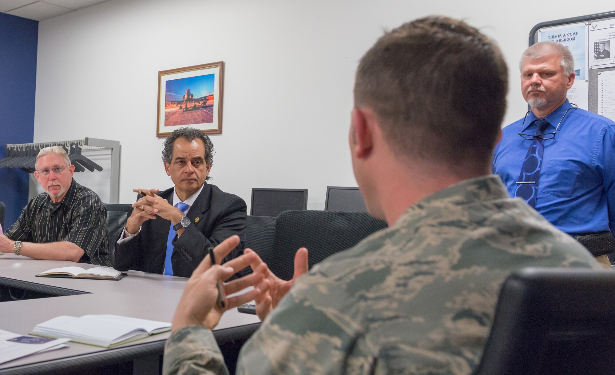 U.S. Air Force Maj. Nicholas Moore, 335th Training Squadron flight commander, briefs Dr. Randy Mayberry, Continuum of Learning Engagement Team representative, and Masoud Rasti, Headquarters Air Education and Training Command business relations manager, on the future direction of the finance course in Allee Hallat Keesler Air Force Base, Mississippi, May 8, 2018. Mayberry and Rasti’s visit was to gauge current technology and training and to discuss what issues could be solved through funding. (U.S. Air force photo by Andre’ Askew)
