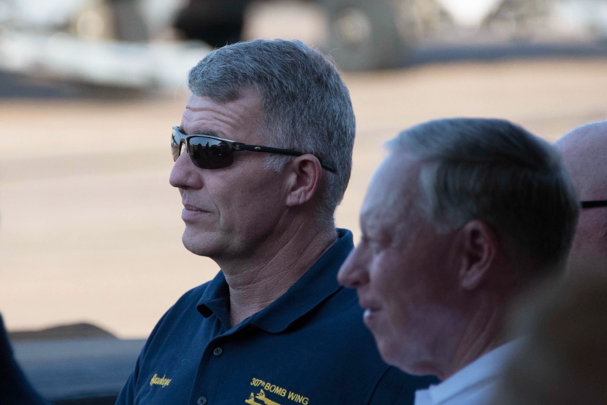 U.S. Air Force Col. Robert VanHoy, 307th Bomb Wing commander, (left) and retired Brig. Gen. Jack Ihle listen to a speech from General Robin Rand, commander of Air Force Global Strike Command, at Barksdale Air Force Base, Lousiana, May 10, 2018.  The two were on hand for a civic leader social.  Civic Leaders from across the Shreveport and Bossier City, Louisiana area gathered to learn more about Barksdale and its mission.  The event featured static displays of the B-52 Stratofortress, B-1 Lancer, and B-2 Spirit aircraft. (U.S. Air Force photo by Master Sgt. Ted Daigle)