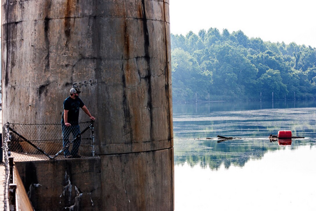 Nick Ruff, a power plant electrician for the U.S. Army Corps of Engineers Savannah District, assists in performing an inspection on one of the concrete piers of the New Savannah Bluff Lock and Dam on May 13, 2013. (U.S. Army Corps of Engineers photo by Scott Hyatt)