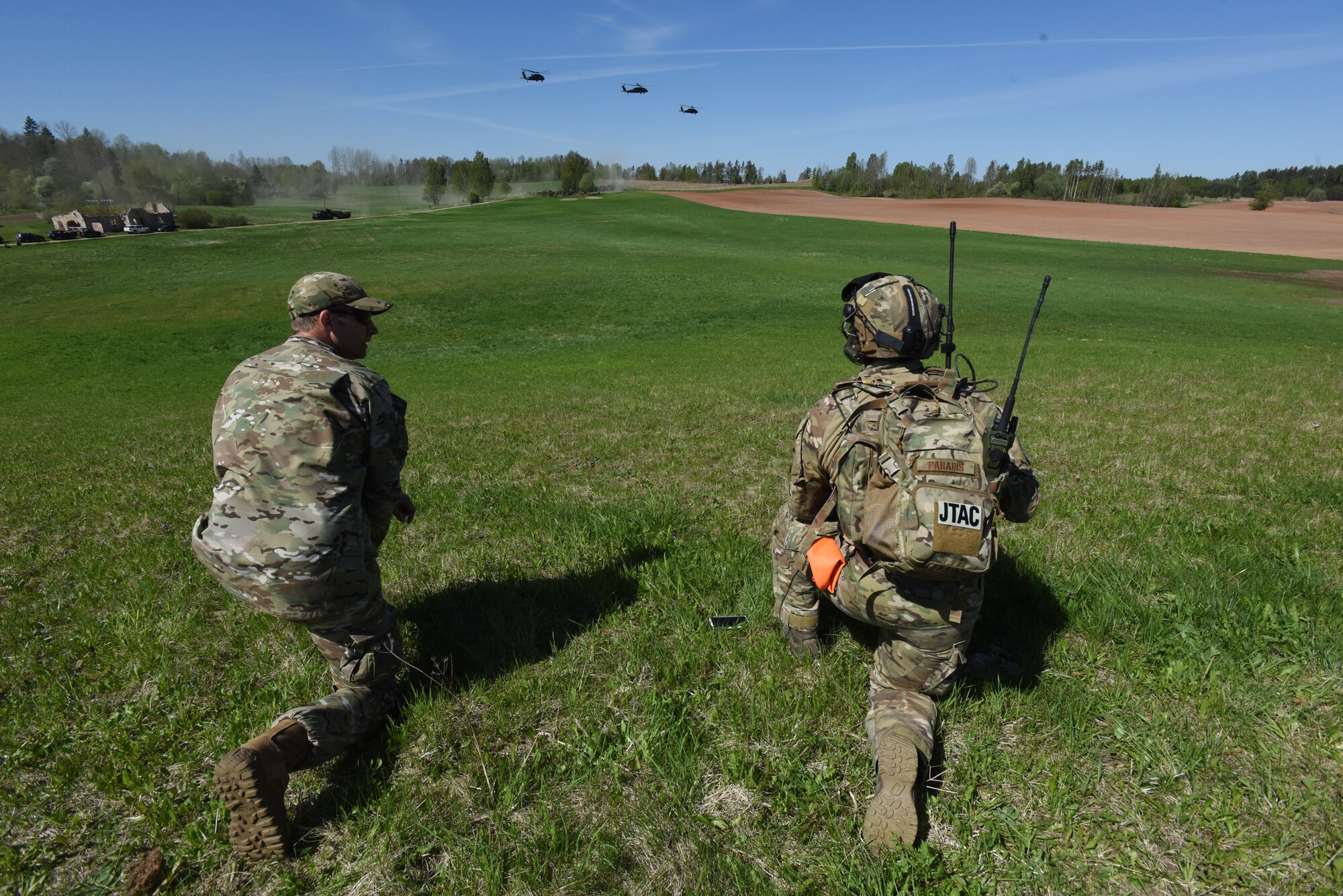 U.S. Air Force Maj. Karl Hurdle, Air Liaison Officer (Left), and Tech Sgt. Laurence Paradis, Tactical Air Control Party member with Okla. National Guard’s 146th Air Support Operations Squadron, advises Estonian Defense Force on Joint Terminal Attack Controller capabilities May 9th during Exercise HEDGEHOG 2018 in Southern Estonia. The TACP personnel served as advisers to the Estonian Defense Force to create combined fires between U.S. Army and multinational aviation assets.  Photo By Maj. Kurt M. Rauschenberg, 58th EMIB Public Affairs Officer.