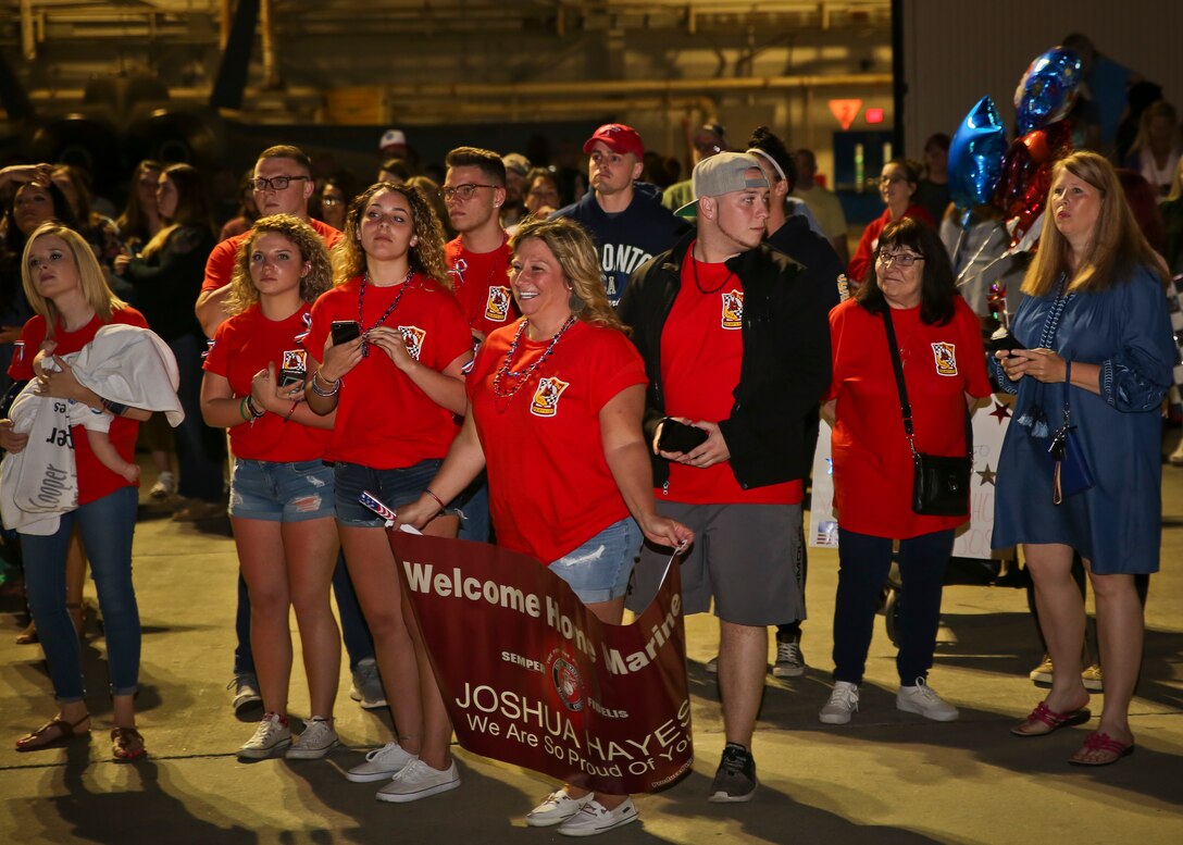 Families wait for their Marines to return from their deployment May 7. Marines and Sailors of Marine Fighter Attack
Squadron 312 returned to Marine Corps Air Station Beaufort after being deployed aboard the USS Theodore
Roosevelt. The Checkerboards were deployed in support of combat operations overseas and maritime security cooperation
efforts in the U.S. 5th and 7th Fleet areas of operations