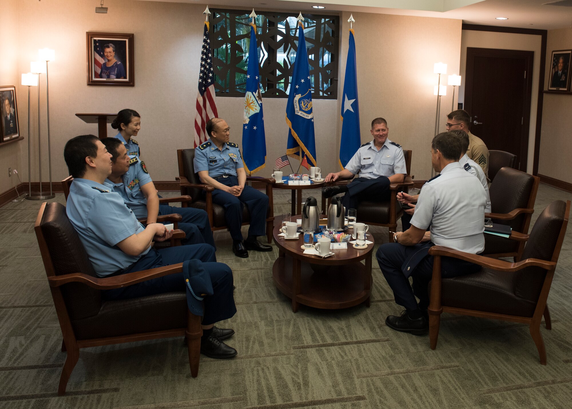 Brig. Gen. Michael Winkler, Pacific Air Forces (PACAF) Strategy, Plans and Programs director talks with Chinese Maj. Gen. Lan, Deputy Political Commissary/Secretary of Discipline Inspection, People's Liberation Army Air Force (PLAAF) Command College during an office call at Joint Base Pearl Harbor-Hickam, April 26, 2018.