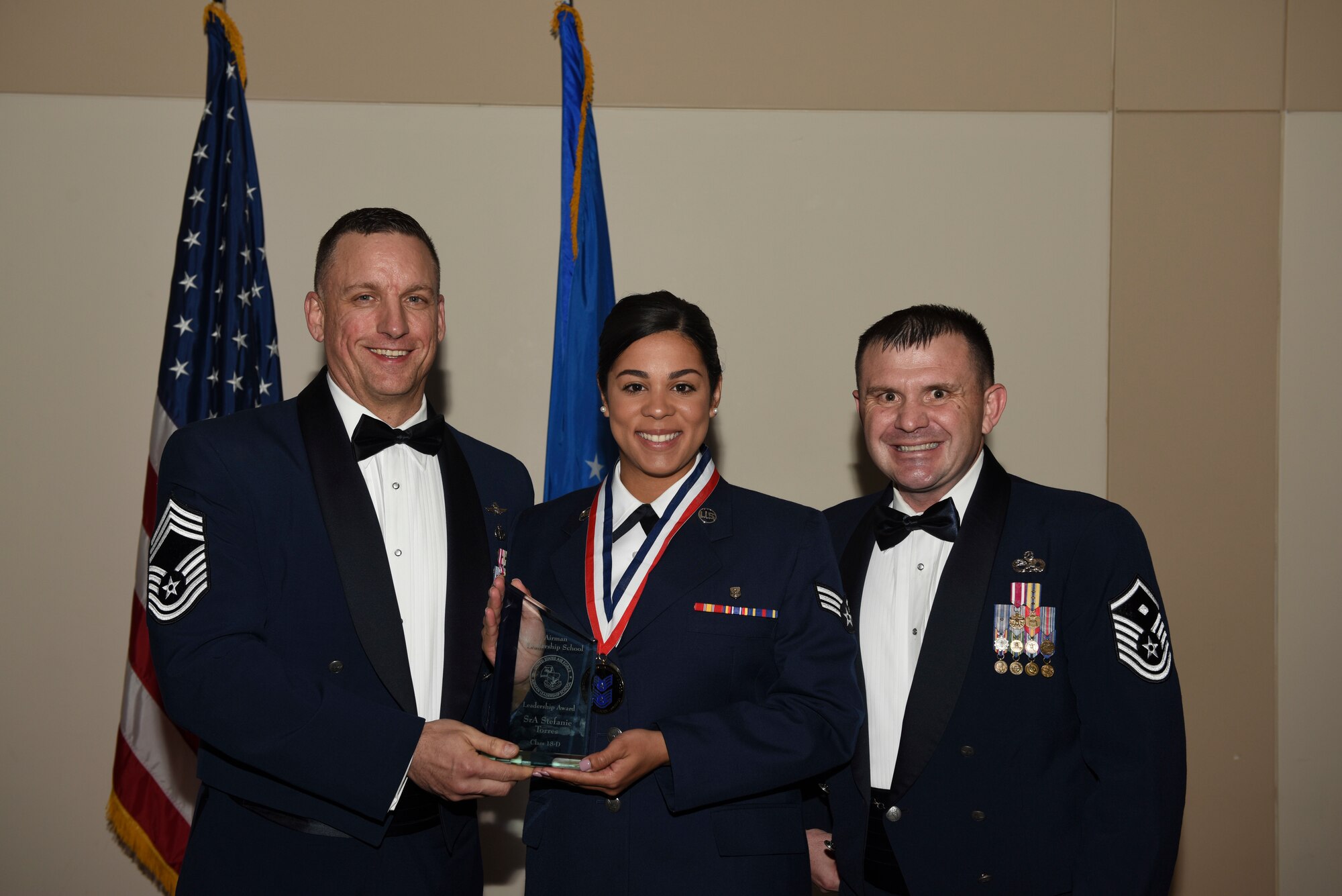 Airman Leadership School class D-18 stand together one final time for a group photo during their graduation May 10, 2018, on Buckley Air Force Base, Colorado. ALS is a 24-day United States Air Force program designed to develop Airmen into effective front-line supervisors. (U.S. Air Force photo by Airman 1st Class Michael D. Mathews)