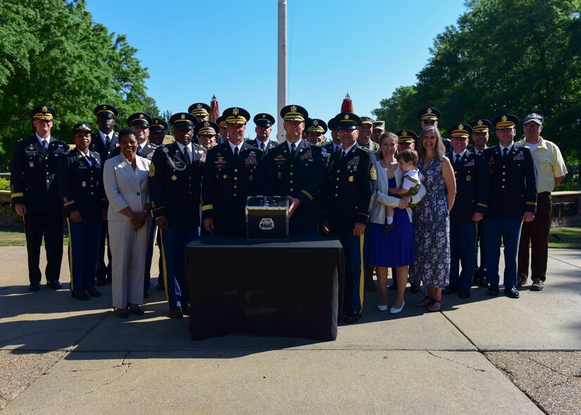 Joint Base Langley-Eustis senior leaders gather around a time capsule at Fort Eustis, Virginia, May 11, 2018. In honor of Fort Eustis’ centennial, JBLE also prepared a time capsule containing memorabilia from its various units and organizations. (U.S. Air Force photo by Airman 1st Class Monica Roybal)
