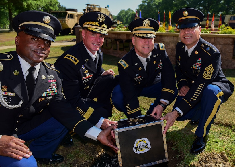 Fort Eustis leaders hold a time capsule at Joint Base Langley-Eustis, Virginia, May 11, 2018. JBLE leaders hope the capsule will serve as a benchmark by which to measure progress when it should be unearthed in 2118. (U.S. Air Force photo by Airman 1st Class Monica Roybal)