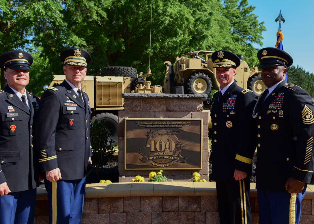 Fort Eustis leaders stand next to a Fort Eustis 100th Anniversary plaque at Joint Base Langley-Eustis, Virginia, May 11, 2018. In conjunction with Fort Eustis’ 100th anniversary celebration, Joint Base Langley-Eustis rededicated Seay Plaza to pay tribute to the 50th anniversary of the Vietnam War during a time capsule burial ceremony. (U.S. Air Force photo by Airman 1st Class Monica Roybal)