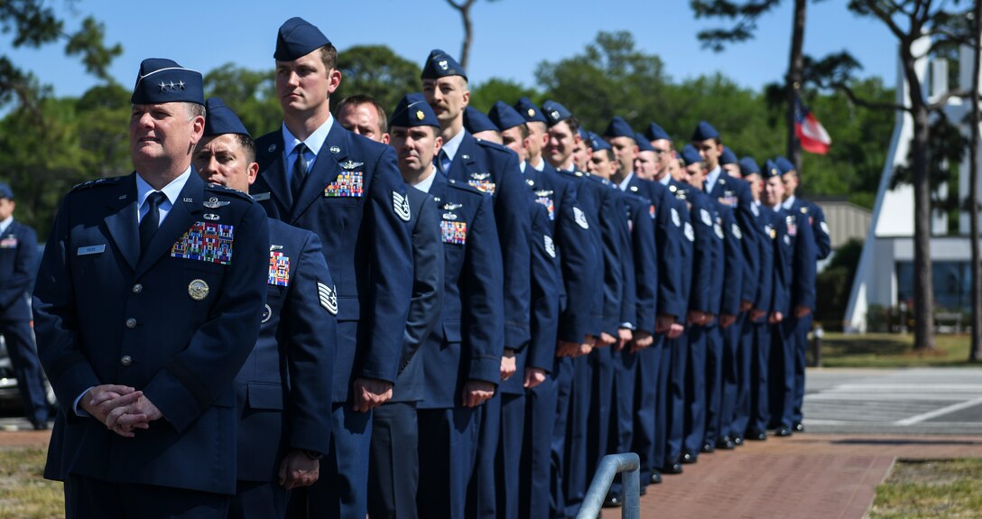 U.S. Air Force Lt. Gen. Brad Webb, commander of Air Force Special Operations Command presents 21 Distinguished Flying Crosses to Air Commandos during a ceremony.