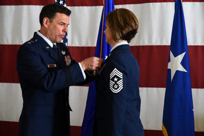 U.S. Air Force Maj. Gen. Matthew Molloy, Air Force Operational Test and Evaluation Center commander, pins the Legion of Merit Medal onto Chief Master Sgt. Bobbie Fillbrandt during her retirement ceremony at the Louis F. Garland Department of Defense Fire Academy on Goodfellow Air Force Base, Texas, May 10, 2018. The Legion of Merit is an award given for exceptionally meritorious conduct in the performance of outstanding services and achievements. (U.S. Air Force photo by Airman 1st Class Seraiah Hines/Released)