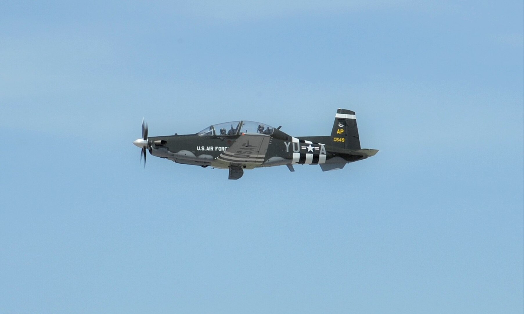 Capt. Kais Heimburger, 455th FTS instructor pilot and Lt. Col. Nik Stathopoulos, 455th FTS director of operations fly a T-6 Texan ll aircraft with  WWII-era B-26 Marauder paint scheme, May 8, 2018 at Joint Base San Antonio-Randolph.  The aircraft is assigned to the 455th Flying Training Squadron at NAS Pensacola, Florida.  (U.S. Air Force photo by Joel Martinez)