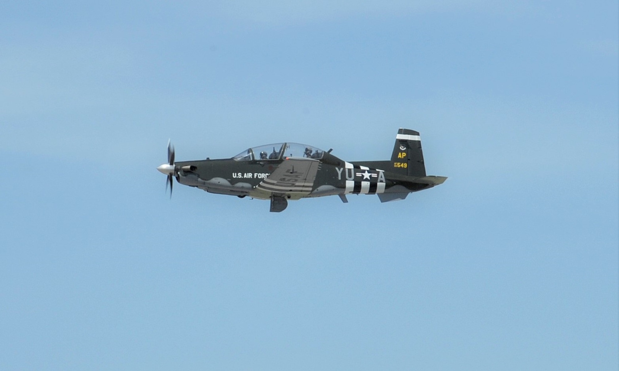 Capt. Kais Heimburger, 455th FTS instructor pilot and Lt. Col. Nik Stathopoulos, 455th FTS director of operations fly a T-6 Texan ll aircraft with  WWII-era B-26 Marauder paint scheme, May 8, 2018 at Joint Base San Antonio-Randolph.  The aircraft is assigned to the 455th Flying Training Squadron at NAS Pensacola, Florida.  (U.S. Air Force photo by Joel Martinez)