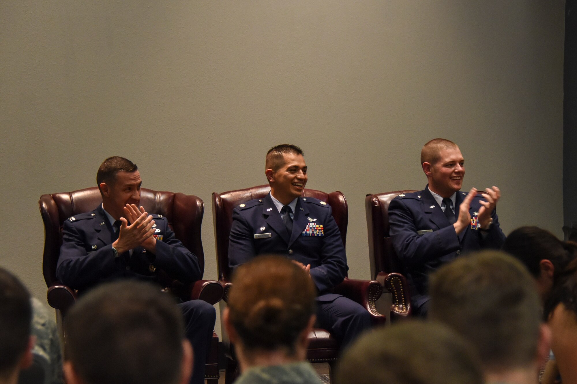 U.S. Air Force Col. Jason Beck, 17th Mission Support Group commander, Maj. Mark Walkusky, 17th Communications Squadron outbound commander, and Maj. David Coté, 17th CS inbound commander, welcome guests of the change of command ceremony in the Event Center on Goodfellow Air Force Base, Texas, May 10, 2018. Goodfellow leadership, members of 17th CS, and family members of both commanders attended the time honored tradition. (U.S. Air Force photo by Airman 1st Class Zachary Chapman/Released)