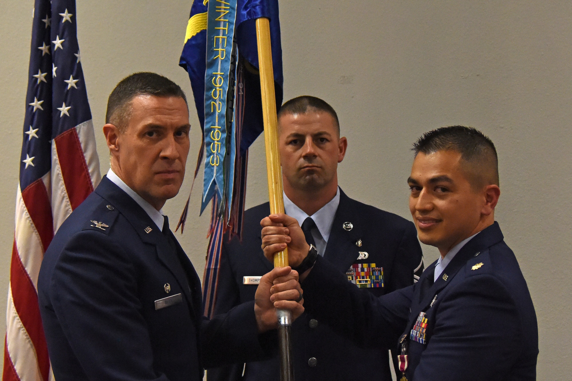 U.S. Air Force Col. Jason Beck, 17th Mission Support Group commander, receives the guideon from Maj. Mark Walkusky, 17th Communications Squadron commander, during the change of command ceremony in the Event center on Goodfellow Air Force Base, Texas, May 10, 2018. The change of command ceremony is a time honored military tradition that signifies the orderly transfer of authority. (U.S. Air Force photo by Airman 1st Class Zachary Chapman/Released)