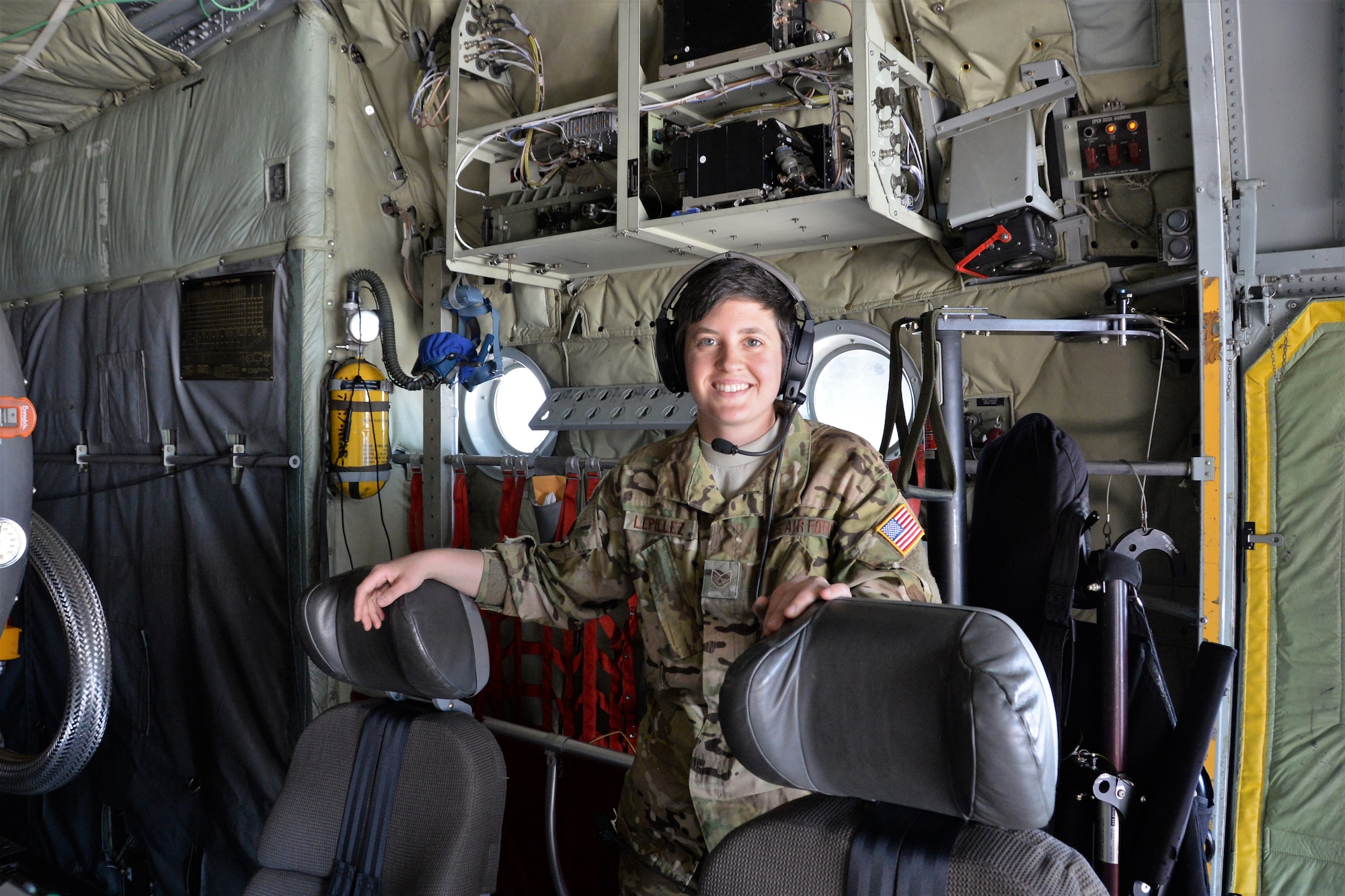 Staff Sgt. Annie Lepillez, a 731st Airlift Squadron loadmaster, poses for a photo before a training mission during the annual wildland firefighting training and certification sponsored by the U.S. Department of Agriculture Forest Service at McClellan Reload Base, California, April 26, 2018.