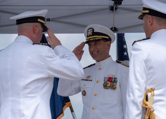 180511-N-LY160-0202 PEARL HARBOR (May 11, 2018) - Cmdr. Kevin Moller, left, reports his relief to Capt. Robert Roncska, commander of Submarine Squadron Seven, middle, during the Los Angeles-class fast-attack submarine USS Jefferson City (SSN 759) change of command ceremony at the USS Bowfin Submarine Museum and Park in Pearl Harbor, Hawaii, May 11. Cmdr. Steven Dawley relieved Moller as the 14th commanding officer of Jefferson City. (U.S. Navy photo by Mass Communication Specialist 2nd Class Michael Lee/Released)
