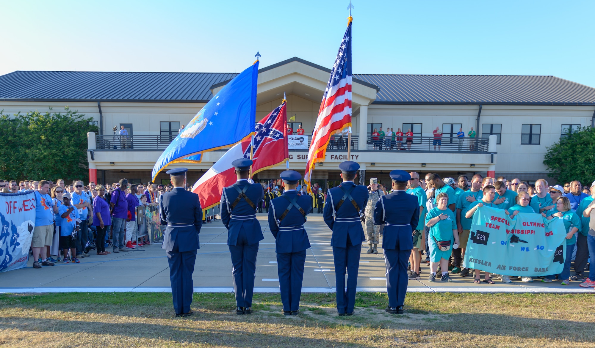 Keesler Honor Guard members present the colors during the Special Olympics Mississippi 2018 Summer Games opening ceremonies at the Levitow Training Support Facility drill pad May 11, 2018, on Keesler Air Force Base, Miss. Founded in 1968, Special Olympics hosts sporting events around the world for people of all ages with special needs to include more than 700 athletes from Mississippi. (U.S. Air Force photo by Andre' Askew)