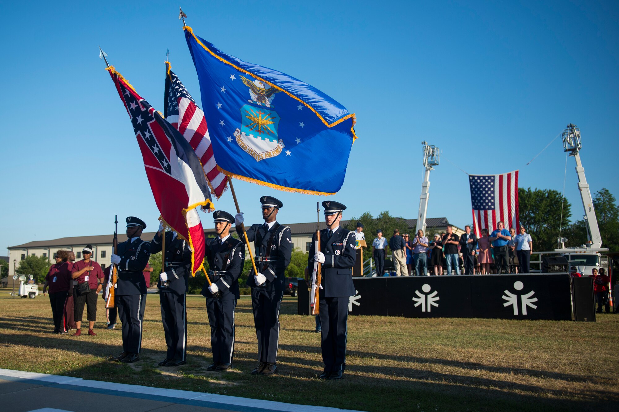 Keesler Base Honor Guard presents the colors during the Special Olympics Mississippi 2018 Summer Games opening ceremony at the Levitow Training Support Facility drill pad at Keesler Air Force Base, Mississippi, May 11, 2018. Founded in 1968, Special Olympics hosts sporting events around the world for people of all ages with special needs to include more than 700 athletes from Mississippi. (U.S. Air Force photo by Senior Airman Travis Beihl)