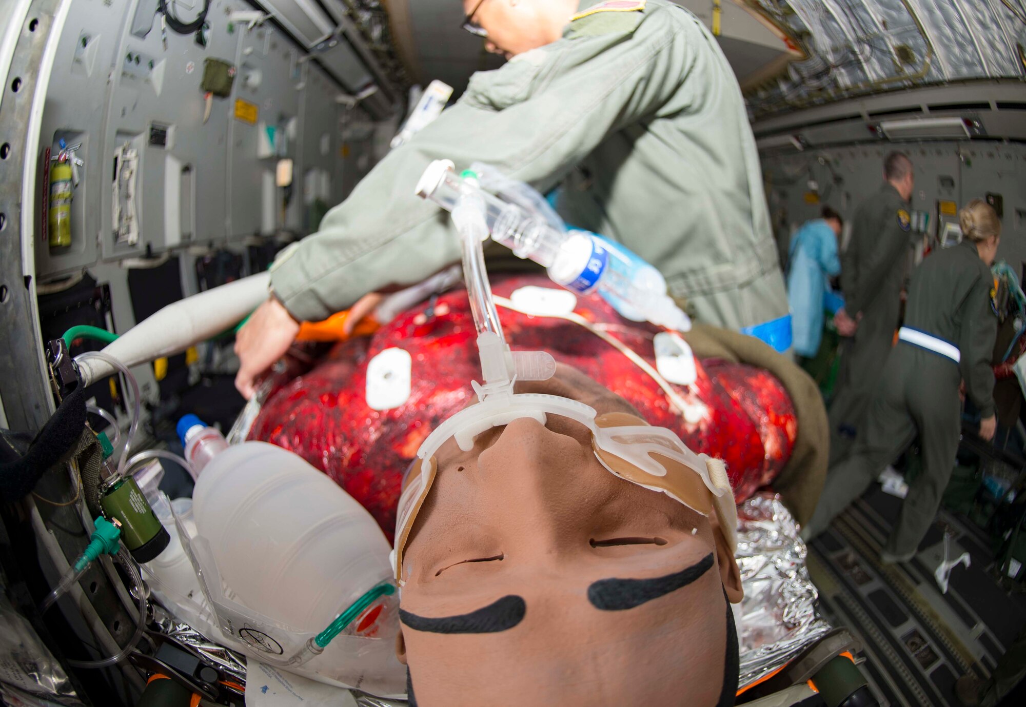 A mannequin receives simulated care during an 86th Medical Squadron (MDS) burn victim evacuation exercise at Ramstein Air Base, Germany, May 9, 2018. To add to the realism of training, the 86th MDS used high-tech mannequins that can mimic human conditions with features such as a simulated pulse, lungs, and heart rate. Nurses can perform such actions as injecting fluids and monitoring vitals. (U.S. Air Force photo by Senior Airman Elizabeth Baker)