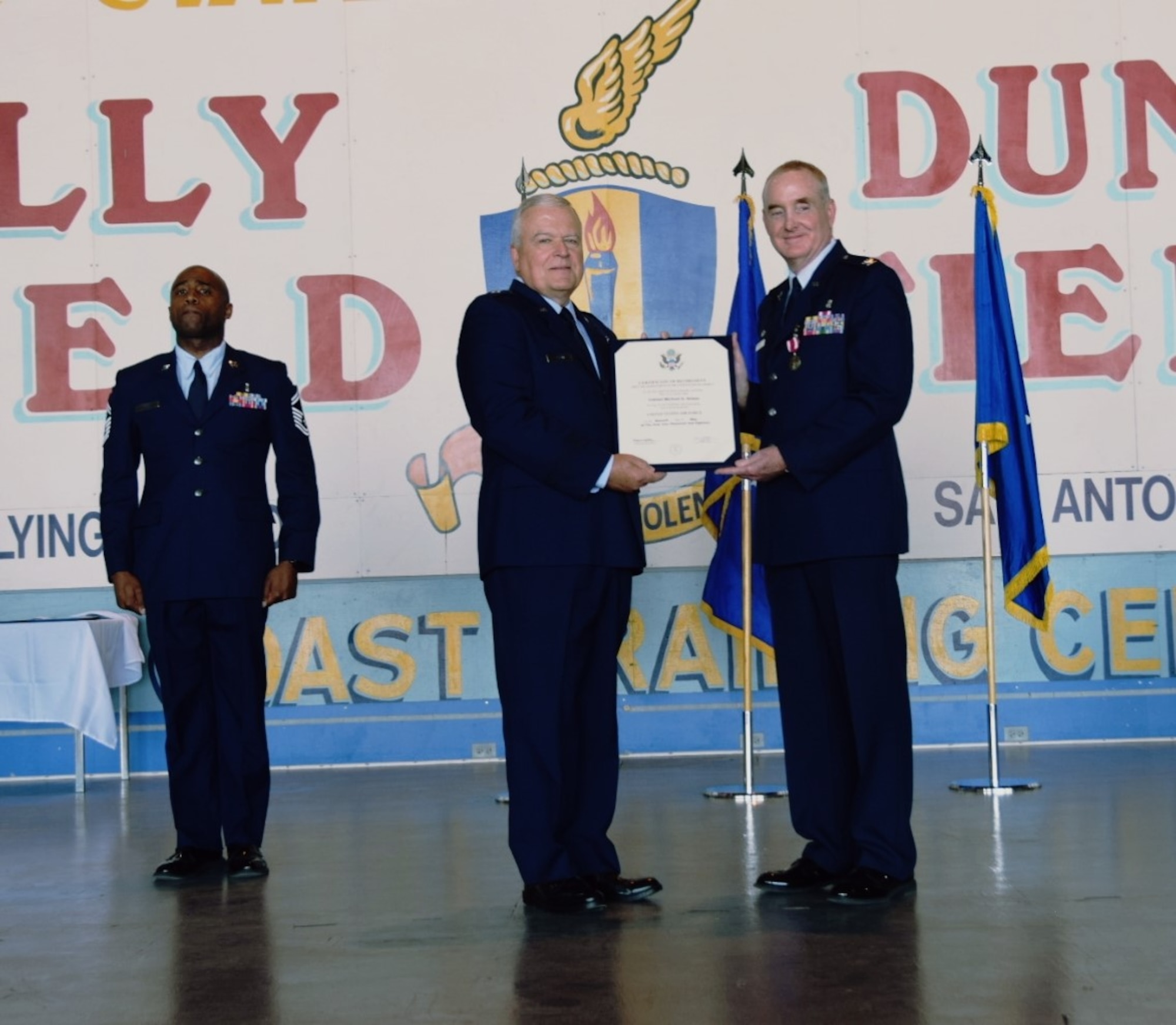 Brig. Gen. John C. Fobian (Ret.), a former 433rd Airlift Wing commander, presents Col. Michael D. Nelson(right), 433rd Medical Squadron commander, the certificate of retirement in a ceremony May 5, 2018 at Joint Base San Antonio, Texas. Nelson’s career in the United States Air Force began as an enlisted member in January 1987. (U.S. Air Force photo by Tech. Sgt. Carlos J. Trevino)