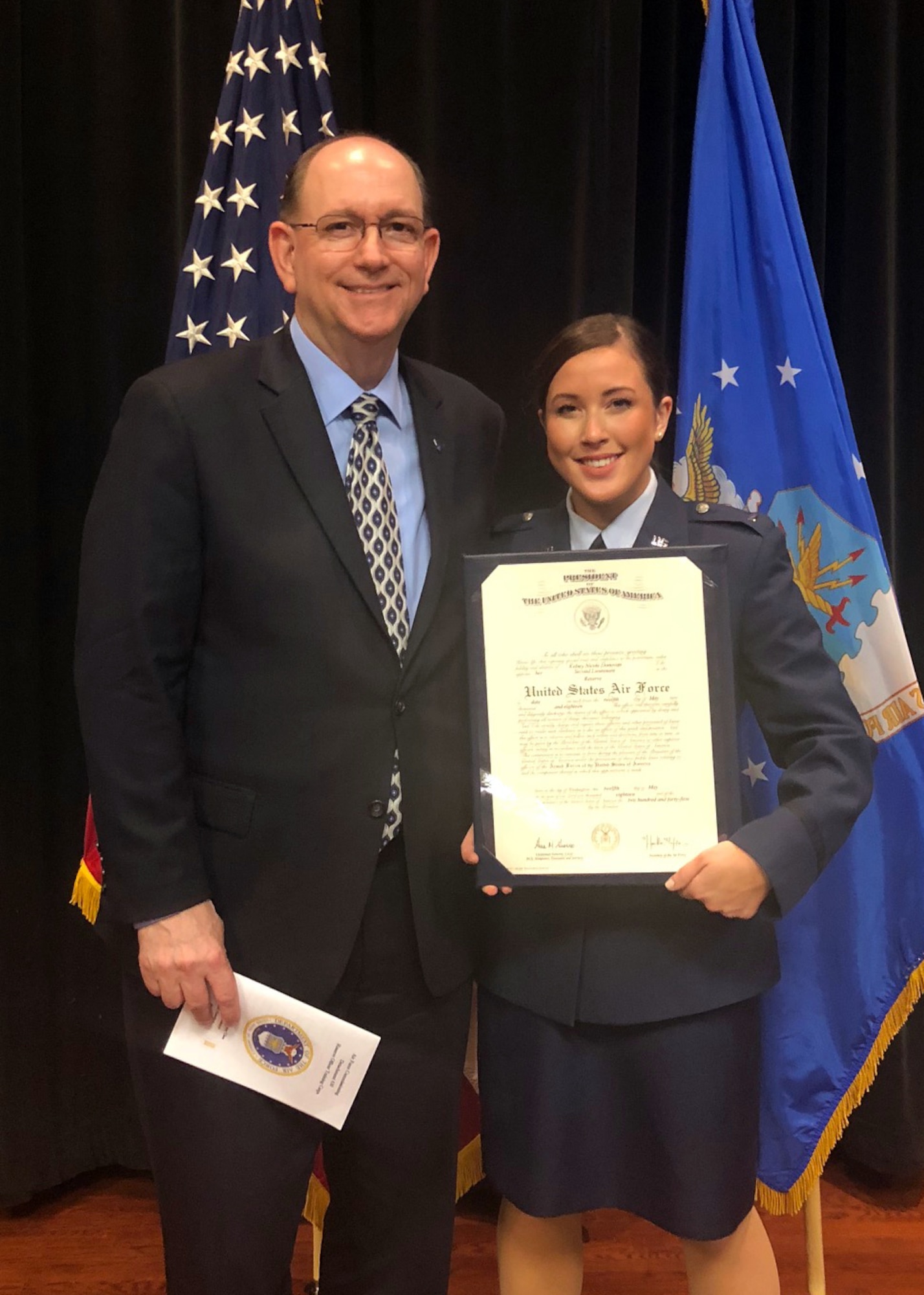 Under Secretary of the Air Force Matthew P. Donovan and 2nd Lt. Kelsey Donovan, pose for a photo during her commissioning ceremony, held May 13, 2018. Lieutenant Donovan is slated to become an intelligence officer and will be stationed at Goodfellow Air Force Base, Texas, later this year. (Courtesy photo)
