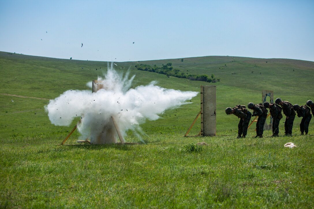 U.S. Marines with Black Sea Rotational Force (BSRF) 18.1 conduct an explosive breach during a demolition range aboard Mihail Kogalniceanu Air Base, Romania, May 7, 2018. The Marines of BSRF participate in demolition and breaching ranges to maintain and improve their explosives handling proficiency. (U.S. Marine Corps Photo by Cpl. Alexander Sturdivant)