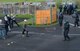 U.S. Air Force Senior Airman Anthony Huerta, 423rd Security Forces Squadron throws a wooden block at Riot Control Police Support Units, RAF Alconbury, United Kingdom, May 2, 2018. The mock riot taught police officers riot control, crowd dispersion, movement techniques and urban tactics. (U.S. Air Force photo by Senior Airman Chase Sousa)