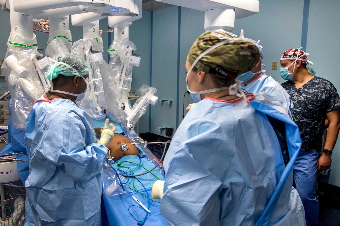 Navy and Sri Lankan doctors perform the first robot-assisted surgery aboard the USNS Mercy.