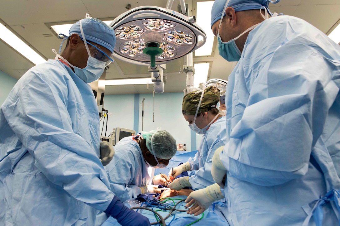 Navy and Sri Lankan doctors remove a patient’s gallbladder aboard the USNS Mercy.