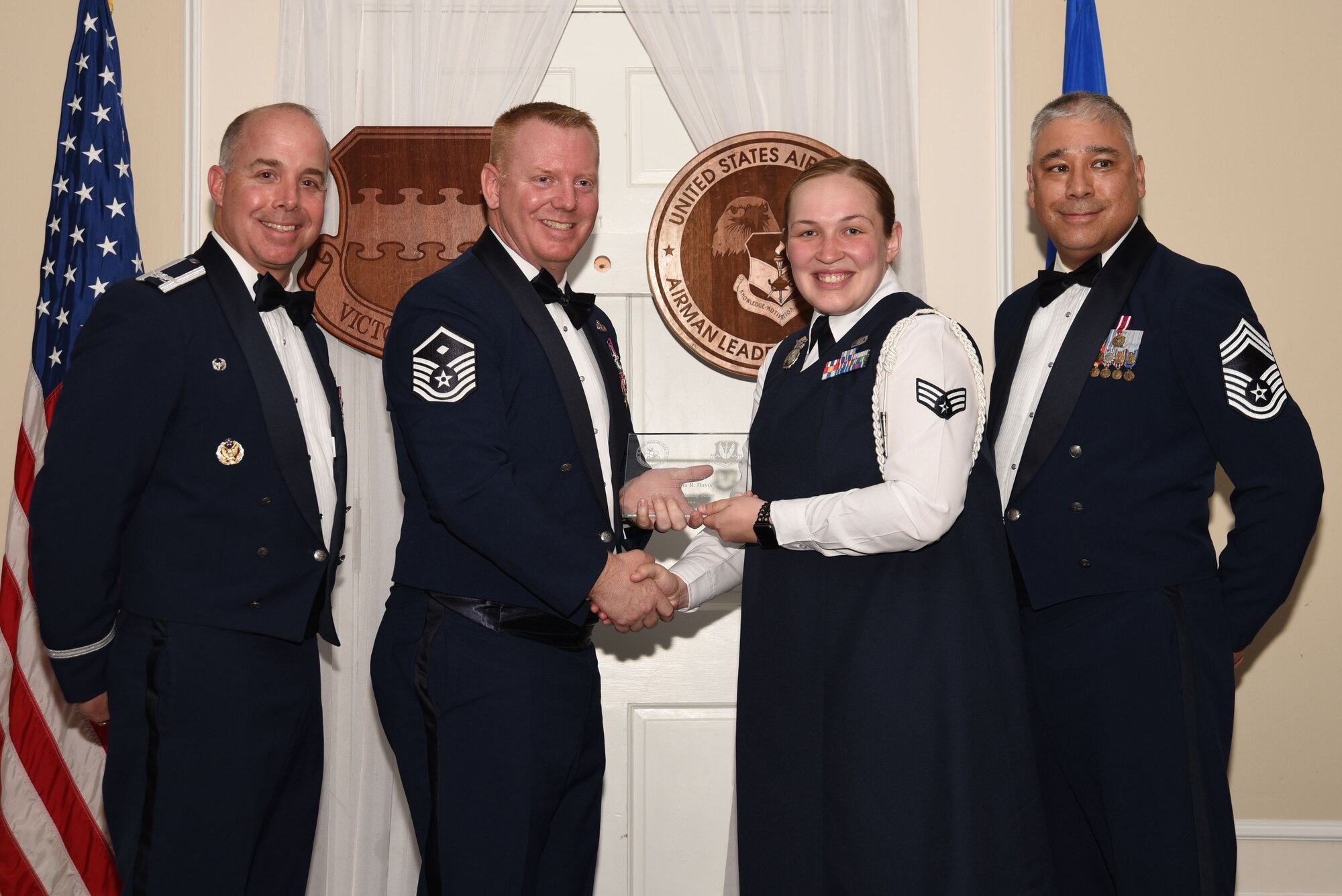 U.S. Air Force Senior Airman Michaela Davis, 20th Security Forces Squadron, receives a distinguished graduate award for Class 18-4 of the Senior Master Sgt. David B. Reid Airman Leadership School, at Shaw Air Force Base, S.C., May 10, 2018.