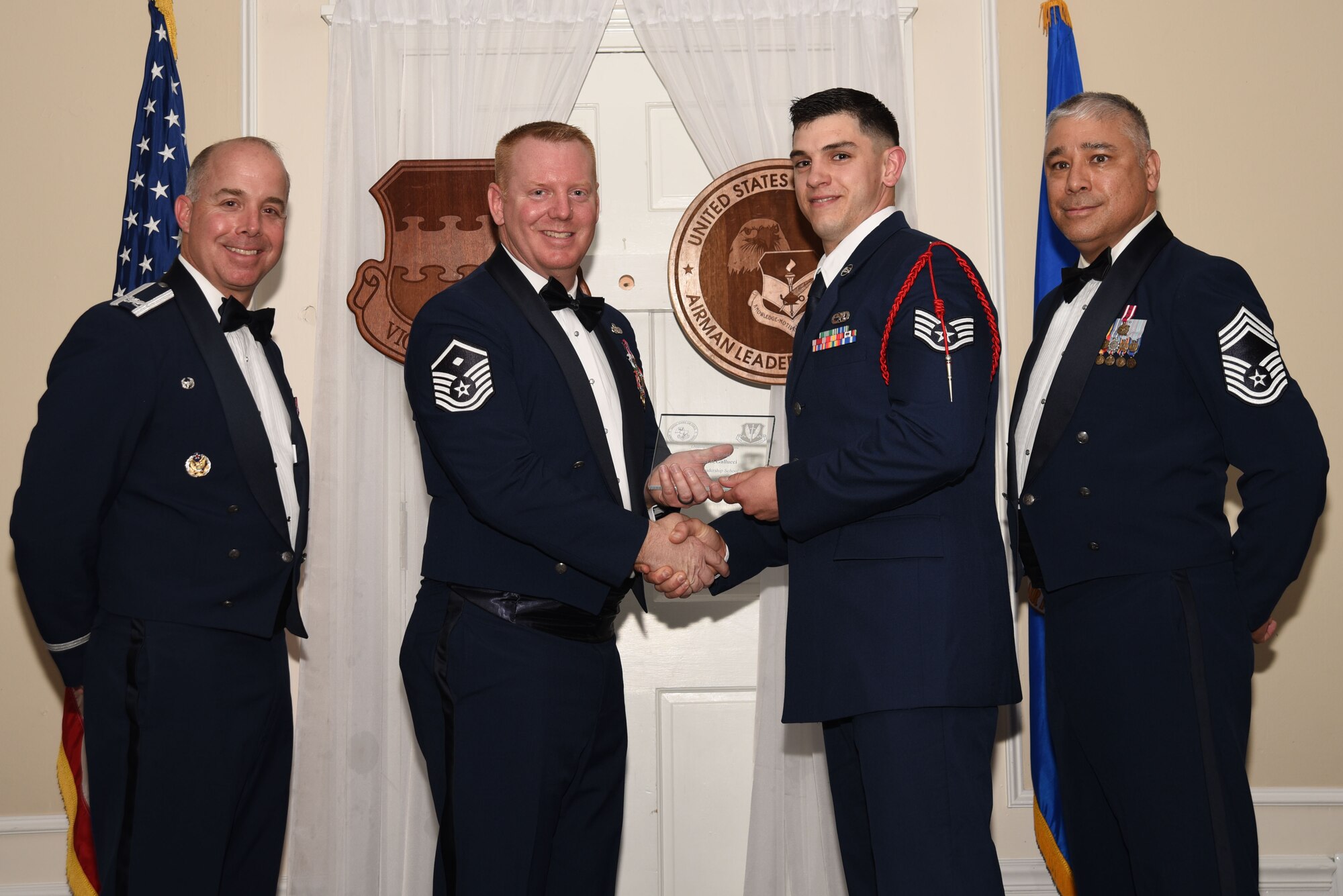 U.S. Air Force Staff Sgt. Michael Gallucci, 20th Aircraft Maintenance Squadron, receives a distinguished graduate award for Class 18-4 of the Senior Master Sgt. David B. Reid Airman Leadership School, at Shaw Air Force Base, S.C., May 10, 2018.