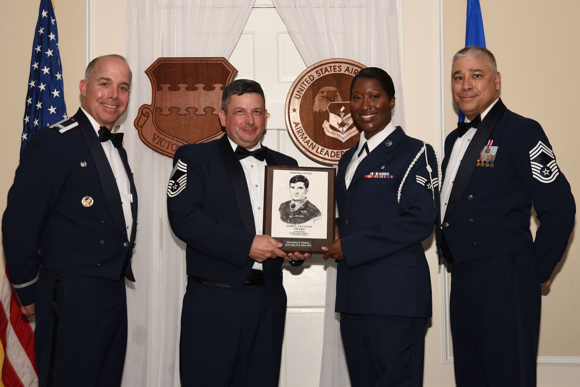 U.S. Air Force Senior Airman Jerelyn Johnson, 20th Medical Operations Squadron, receives the John L. Levitow Award for Class 18-4 of the Senior Master Sgt. David B. Reid Airman Leadership School, at Shaw Air Force Base, S.C., May 10, 2018.