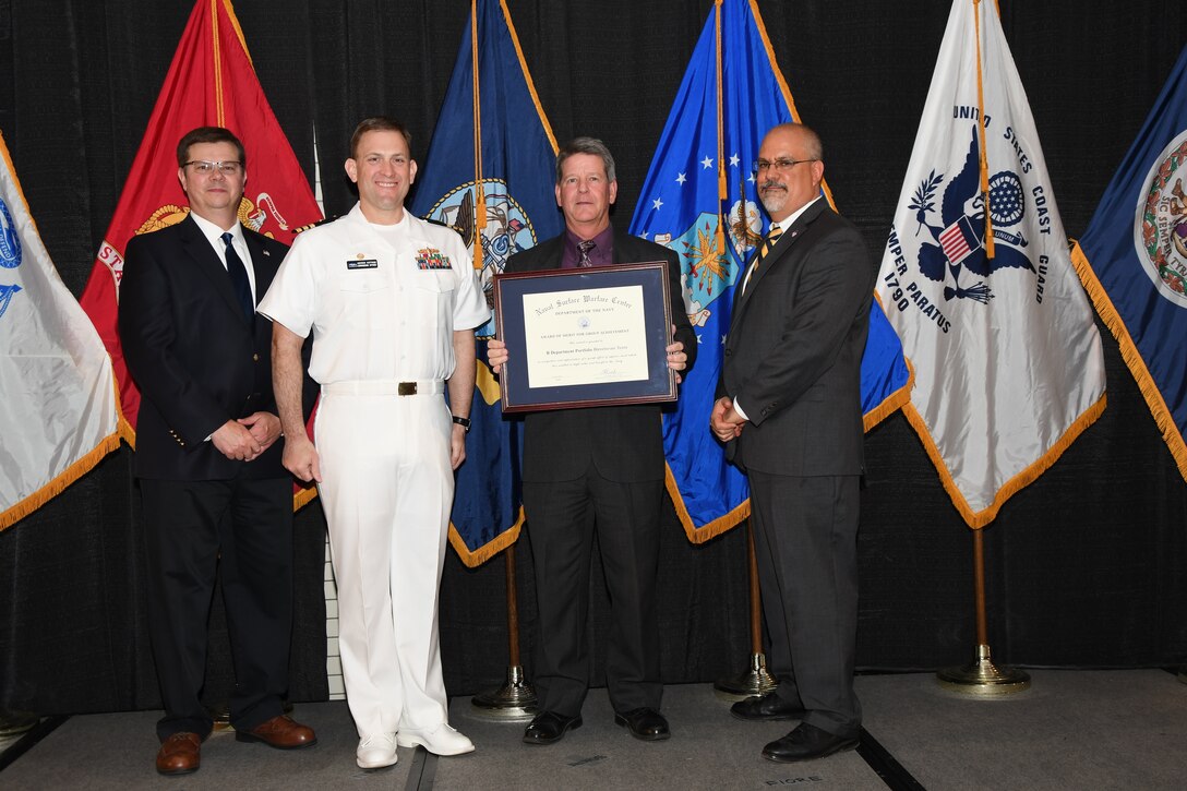 IMAGE: The R Department Portfolio Directorate Team received the Award of Merit for Group Achievement at the Naval Surface Warfare Center Dahlgren Division's annual honorary awards ceremony held Apr. 26 at the Fredericksburg Expo and Conference Center.