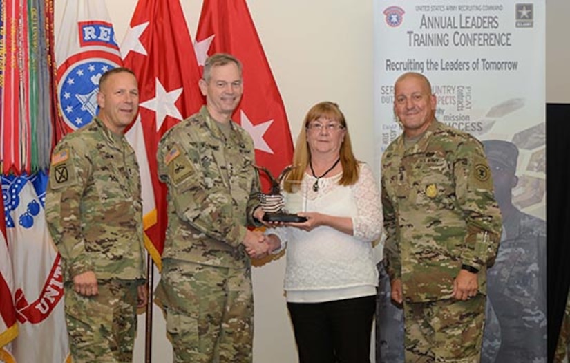 thress soldier awarding a civilian