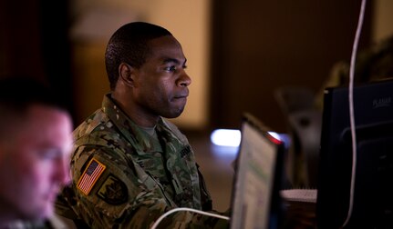 U.S. Army Chief Warrant Officer 3 Clinton Store studies course content during the training week of  Cyber Shield 18 at Camp Atterbury Indiana, May 8, 2018. Cyber Shield gathers Soldiers, Airmen and civilian cyber security professionals to train and conduct exercises that prepare participants for roles in the National Guard’s Defensive Cyber Operations Elements.