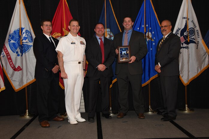 IMAGE: The AC-130 Gun Ships Block 20 Precision Strike Package Initial Operational Capability (IOC) and Deployment Team received the Technology to the Warfighter Award at the NSWCDD Honorary Awards Ceremony held at the Fredericksburg Expo and Conference Center, April 26. The Technology to the Warfighter Award recognizes individuals or groups who have had a notable and significant impact on the warfighter by developing needed capability and transitioning it into operations. The intent of this award is to recognize direct contributions to the warfighter and their operational impact.