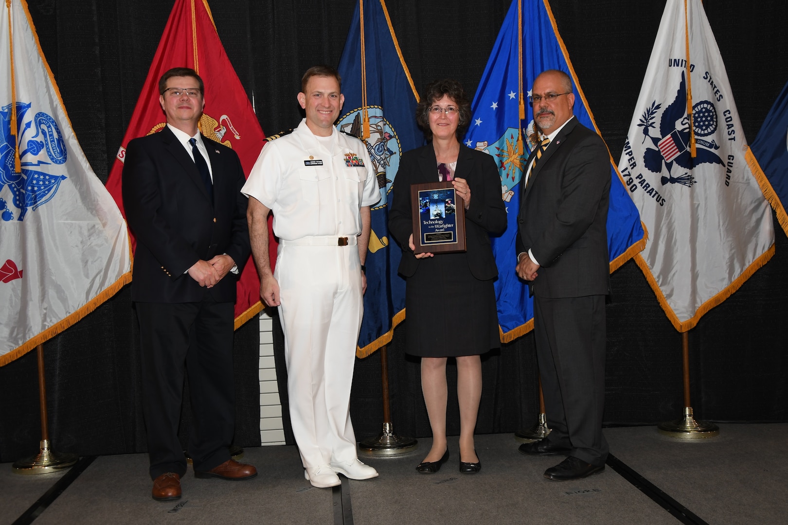 IMAGE: The Combined Integrated Air and Missile Defense and Anti-Submarine Warfare Trainer (CIAT) Version 1
Development and Delivery Team received the Technology to the Warfighter Award at the NSWCDD Honorary Awards Ceremony held at the Fredericksburg Expo and Conference Center, April 26. The Technology to the Warfighter Award recognizes individuals or groups who have had a notable and significant impact on the warfighter by developing needed capability and transitioning it into operations. The intent of this award is to recognize direct contributions to the warfighter and their operational impact.