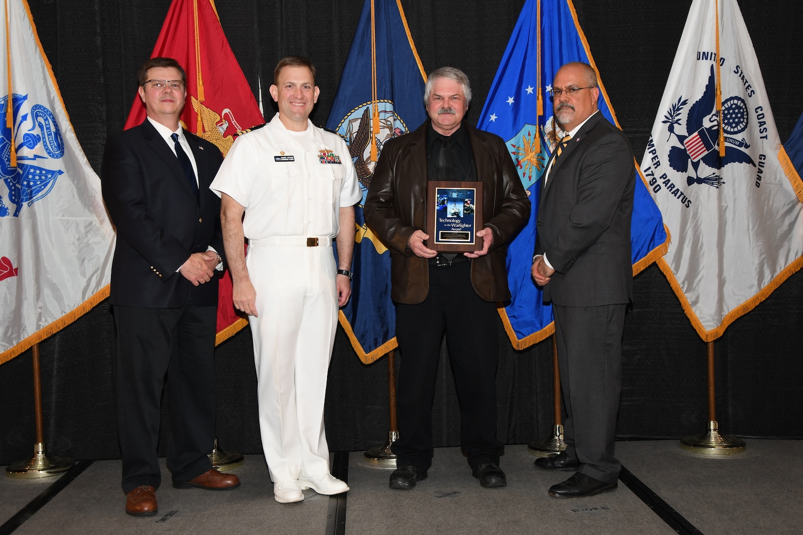 IMAGE: The Common Aviation Command and
Control System Afloat Team received the Technology to the Warfighter Award at the NSWCDD Honorary Awards Ceremony held at the Fredericksburg Expo and Conference Center, April 26. The Technology to the Warfighter Award recognizes individuals or groups who have had a notable and significant impact on the warfighter by developing needed capability and transitioning it into operations. The intent of this award is to recognize direct contributions to the warfighter and their operational impact.