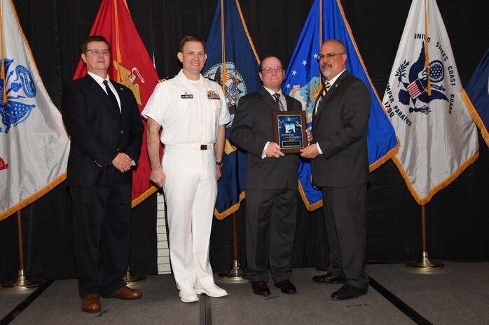 IMAGE: The Gun Weapon System MK 34 High Explosive Multi-Function Fuze Tactics Improvement Team received the Technology to the Warfighter Award at the NSWCDD Honorary Awards Ceremony held at the Fredericksburg Expo and Conference Center, April 26. The Technology to the Warfighter Award recognizes individuals or groups who have had a notable and significant impact on the warfighter by developing needed capability and transitioning it into operations. The intent of this award is to recognize direct contributions to the warfighter and their operational impact.