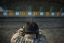 U.S. Marine Corps Sgt. Mike Ibarra, a team leader with 1st Platoon, 1st Reconnaissance Battalion, 1st Marine Division, fires a M9 Beretta semiautomatic handgun during Exercise Platinum Ren, at Fort Trondennes, Harstad, Norway, May 8, 2018.