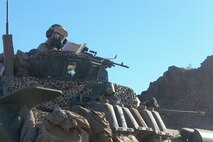 A U.S. Marine with 3rd Light Armored Reconnaissance Battalion, 1st Marine Division confirms grids during Marine Corps Combat Readiness Evaluation (MCCRE) at Marine Corps Air Ground Combat Center Twentynine Palms, Calif., Sept. 21, 2017.