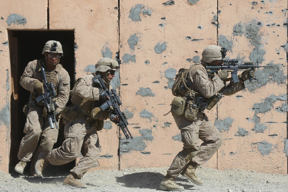 U.S. Marines with 3rd Light Armored Reconnaissance Battalion, 1st Marine Division clear buildings during a Marine Corps Combat Readiness Evaluation (MCCRE) at Marine Corps Air Ground Combat Center Twentynine Palms, Calif., Sept. 23, 2017.