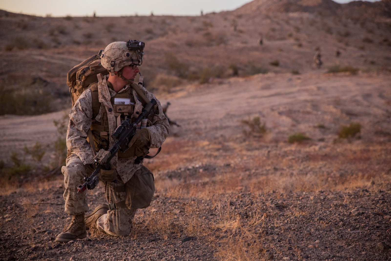 U.S. Marine Corps Cpl. Tanner Reihm, a squad leader with 3rd Battalion, 7th Marine Regiment, 1st Marine Division, provides security during a Marine Corps Combat Readiness Evaluation (MCCRE) at Marine Corps Air Ground Combat Center, Twentynine Palms, Calif., Nov. 28, 2017.