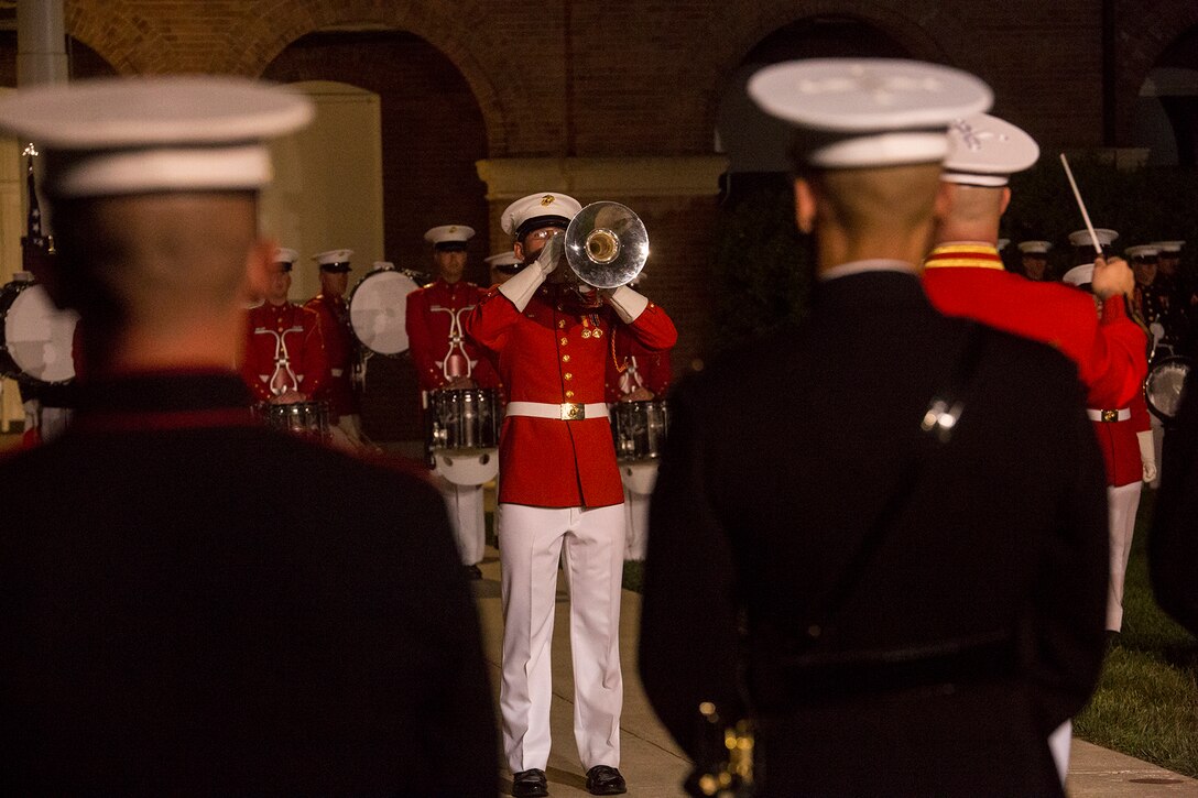 Corporal Brice Bach, uppers section, “The Commandant’s Own” U.S. Marine Drum & Bugle Corps, performs a solo during a Friday Evening Parade at Marine Barracks Washington D.C., May 11, 2018. The guest of honor for the parade was Deputy Secretary of Defense Patrick M. Shanahan and was hosted by the Assistant Commandant of the Marine Corps, Gen. Glenn M. Walters. (Official Marine Corps photo by Cpl. Robert Knapp/Released)