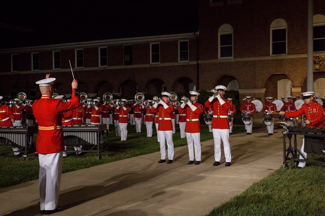 Marines with “The Commandant’s Own” U.S. Marine Drum & Bugle Corps performs a musical ballad during a Friday Evening Parade at Marine Barracks Washington D.C., May 11, 2018.